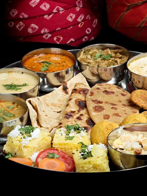 Authentic Rajasthani Dal Baati Churma traditional thali plate - must-eat food Jaipur tourism guide for foreign visitors